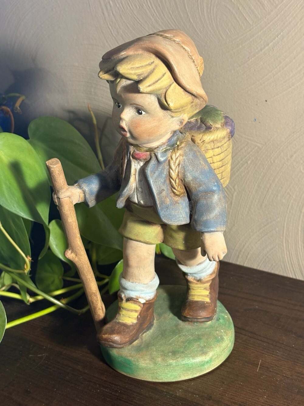 Vintage 9-inch Chalkware Boy with Walking Stick and Grape Basket Figurine
